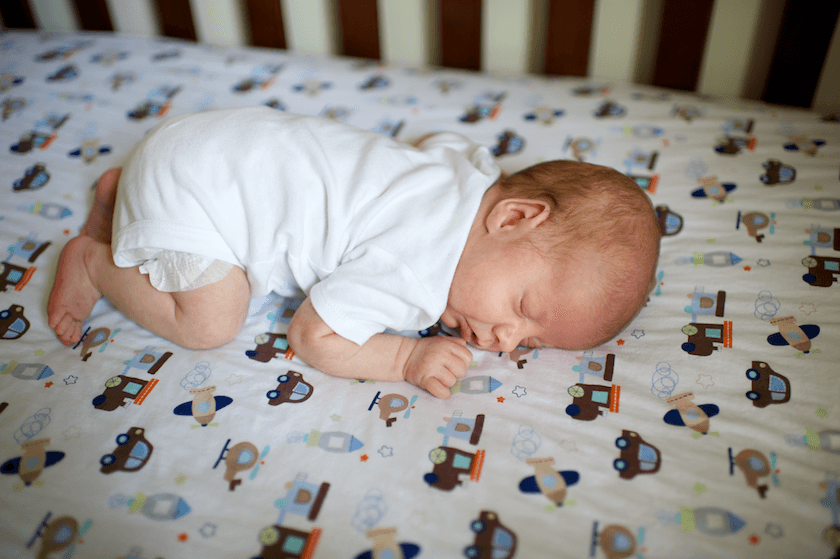 infant sleeping on stomach